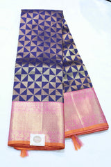 Saree with pink and blue geometric pattern on a white background